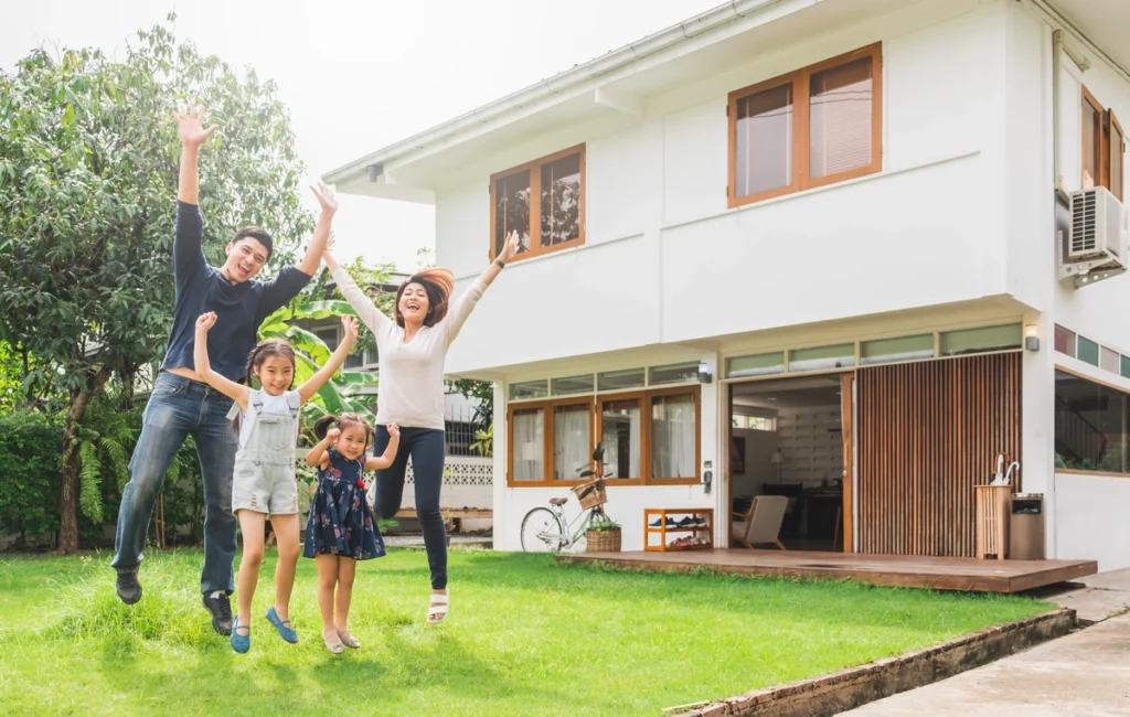 family-in-front-of-home
