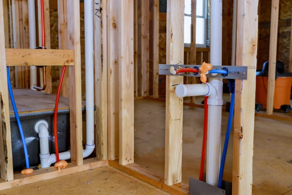 framing out the bathroom and installing shower plumbing materials