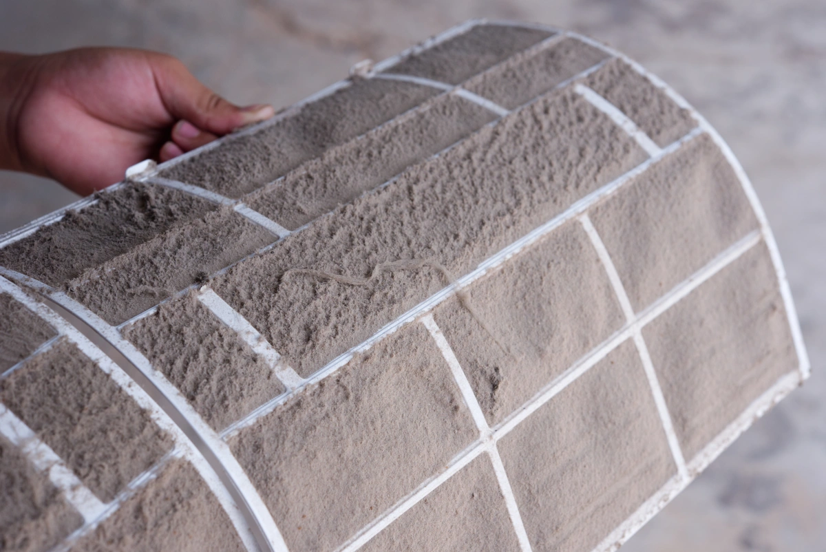 how often to change furnace filter-close up of very dirty furnace filter