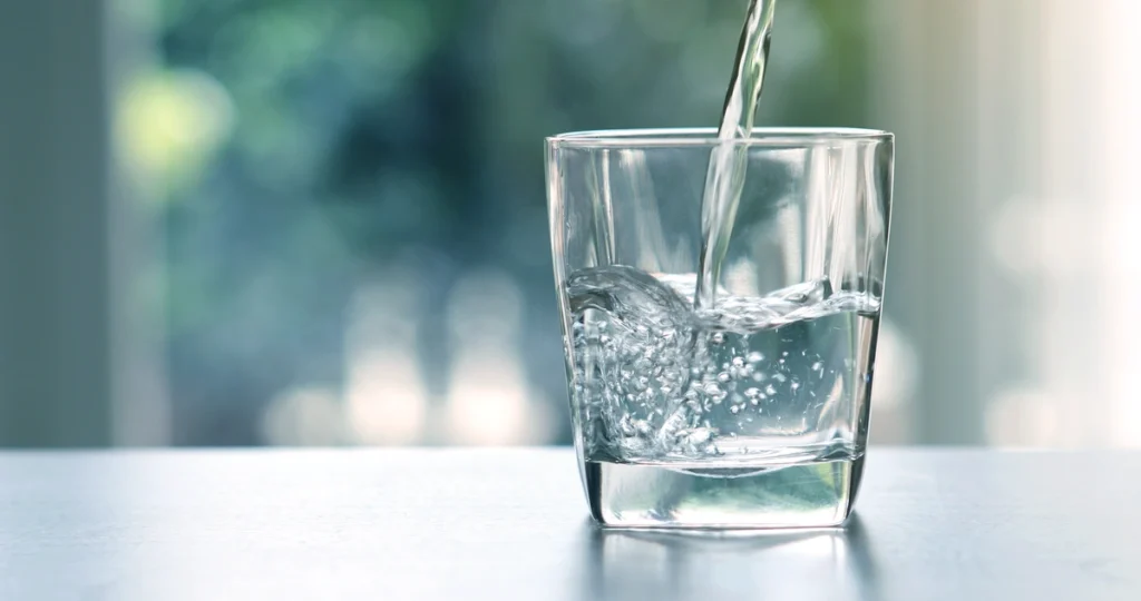 glass being filled with water.