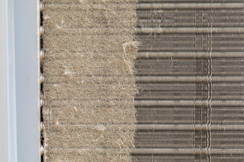 ac coil cleaner-close up image showing the difference between dirty and cleaned coils