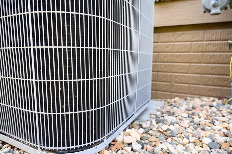ac coil cleaner-close up of ac unit with debris-free coils
