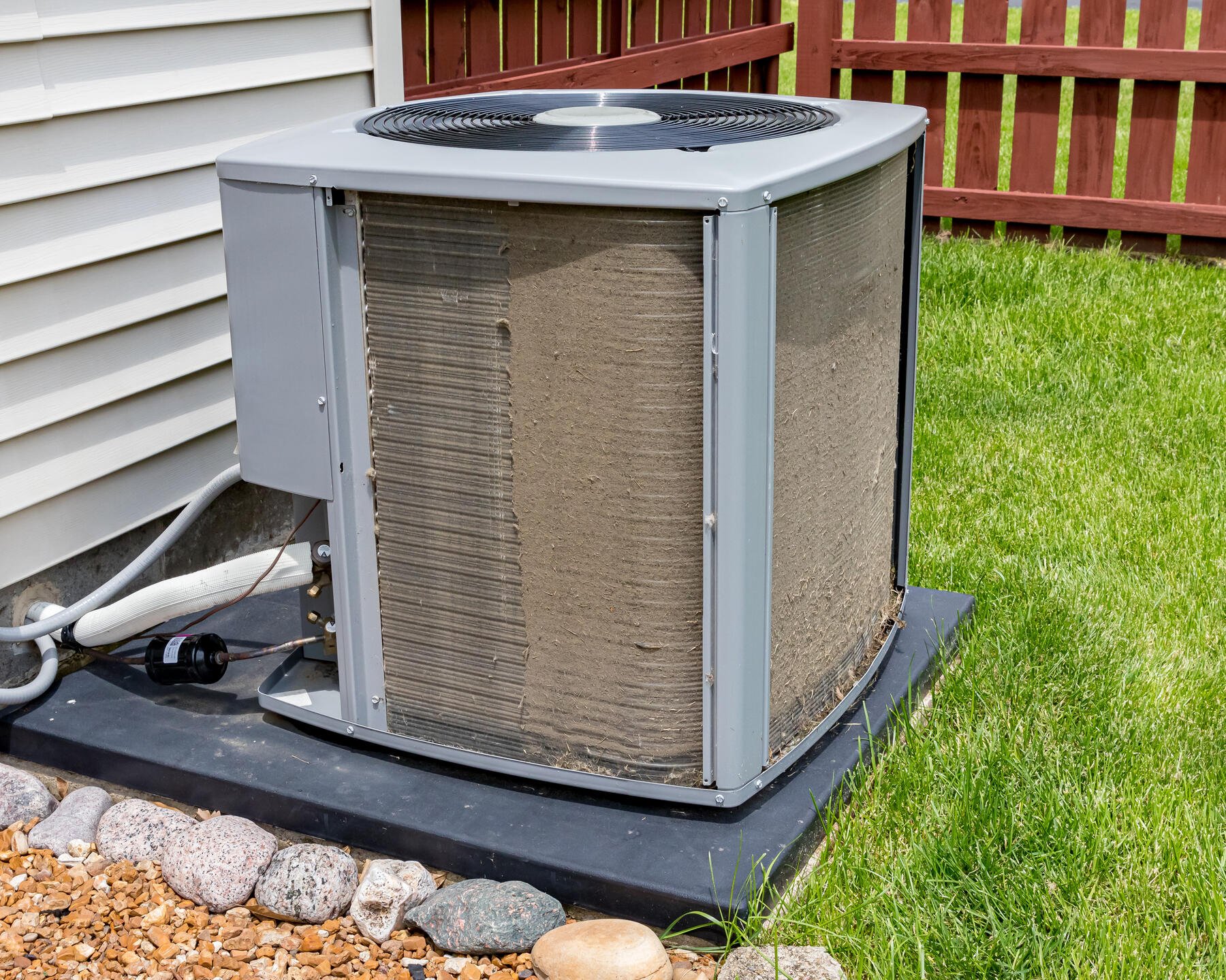 ac coil cleaner-side by side comparison of an ac unit with dirty and clean coils
