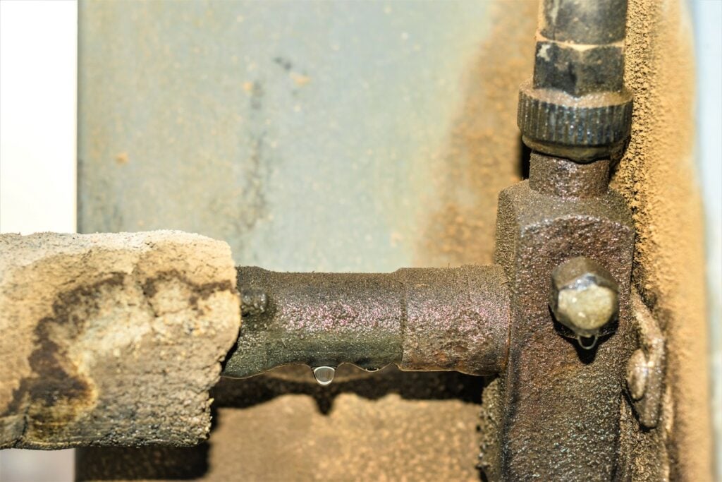 ac leaking water-rusty and cracked pipes