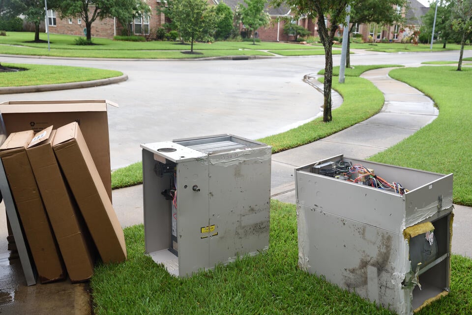 furnace replacement-old furnace on curb for trash pick up