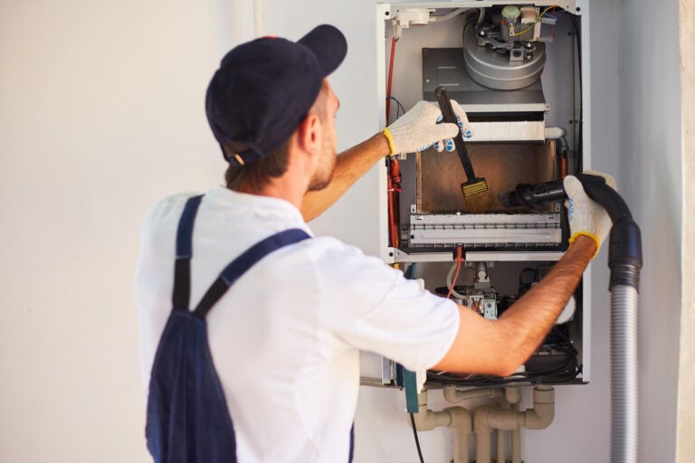 heating system repair-repair tech doing maintenance on a heating system