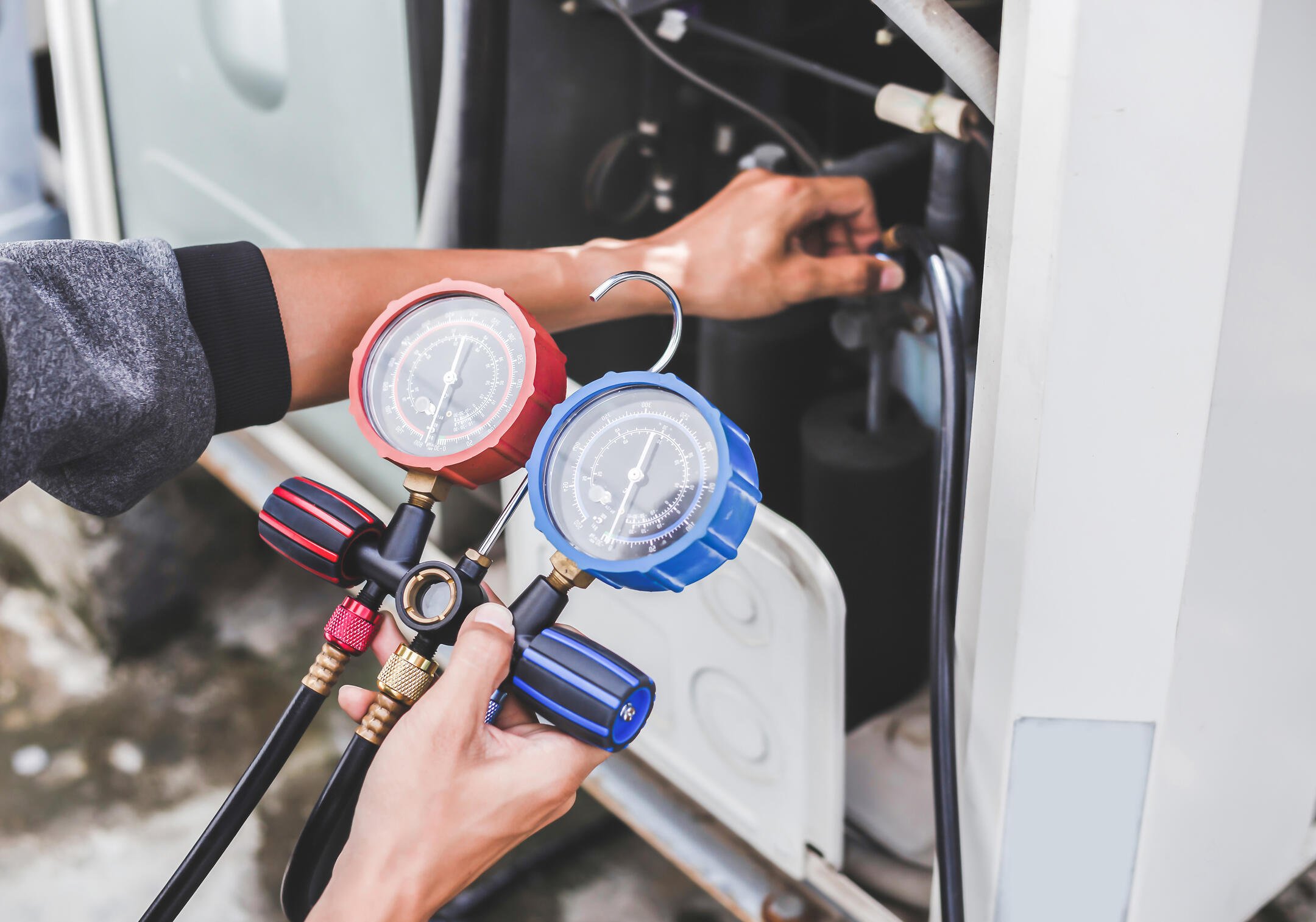 low refrigerant-tech checking status of ac unit