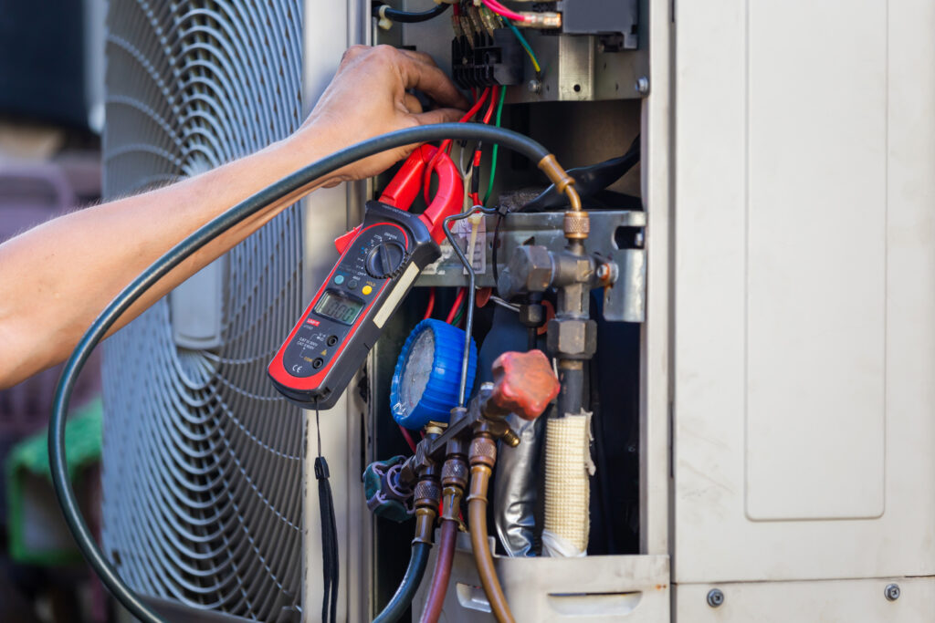 what does hvac stand for Air Conditioning Repair man hands checking and fixing modern air conditioning system, Technician team checking leakage air conditioning system