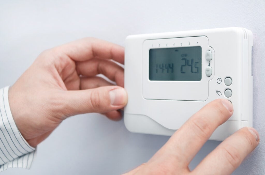 thermostat replacement Modern furnace setting panel. Depth of field on the buttons